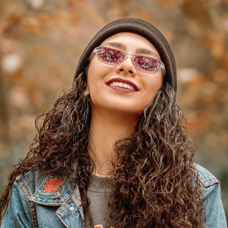 Alex Morgan, Lead Design Curator at EquitRaveMaxor, reviewing corporate floral arrangements